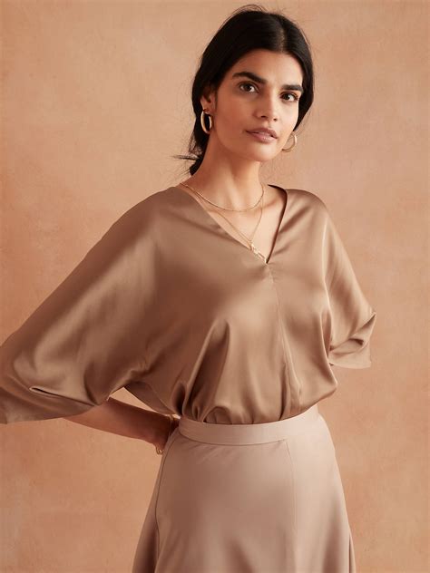 Banana republic dolman top - Shop Banana Republic Factory's Forever Dolman V-Neck Sweater: Thoughtfully made with 40% Livaeco™ Viscose, produced from sustainable sourced renewable raw material and manufactured using closed-loop process that use up to 60% less water as compared to generic viscose., V-neck. Long dolman sleeves., Drop shoulders., Ribbed neck, arm …